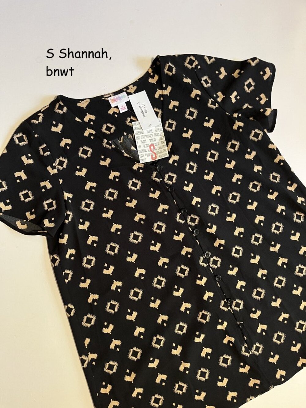 Small Lularoe Shannah button top, black with tan tribal symbols